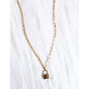 Gold lock necklace with paperclip chain 20” length.  NWT